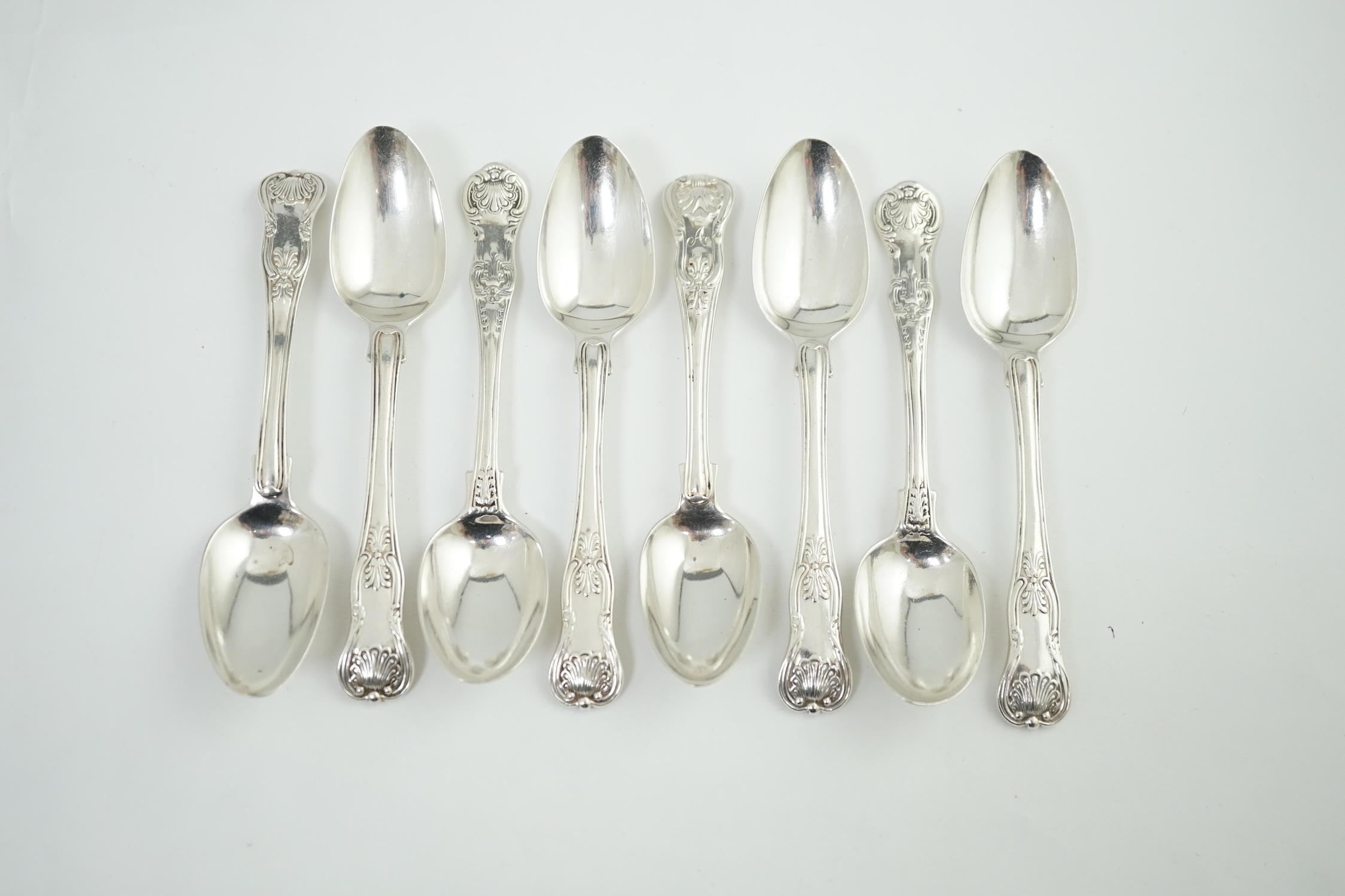 A harlequin set of eight Georgian and Victorian silver Kings pattern teaspoons, various dates and makers